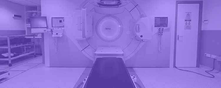 Empty radiotherapy machine in the hospital with a purple overlay