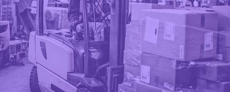 Men at warehouse riding forklift carrying boxes with purple overlay