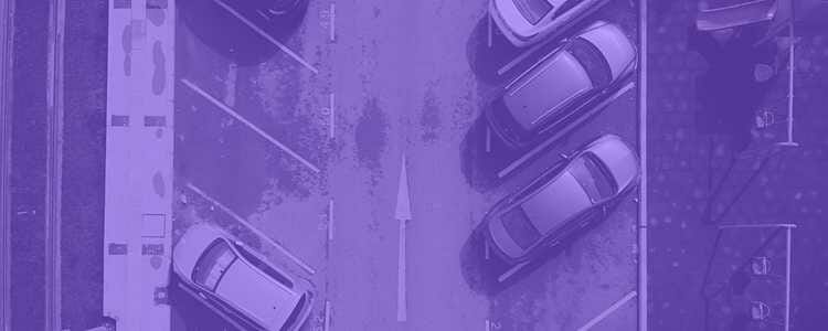 parked cars in a row in a parking lot with a purple overlay