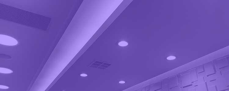 Top of a ceiling with lights turned on in a purple overlay
