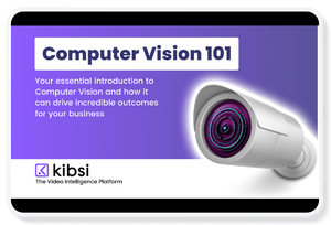 Cover in purple box with black outline with the words Computer Vision 101. In smaller text the words Your essential introduction to Computer Vision and how it can drive incredible outcomes for your business. In the corner is the Kibsi logo with the words The Video Intelligence Platform underneath. Picture also shows video security camera.